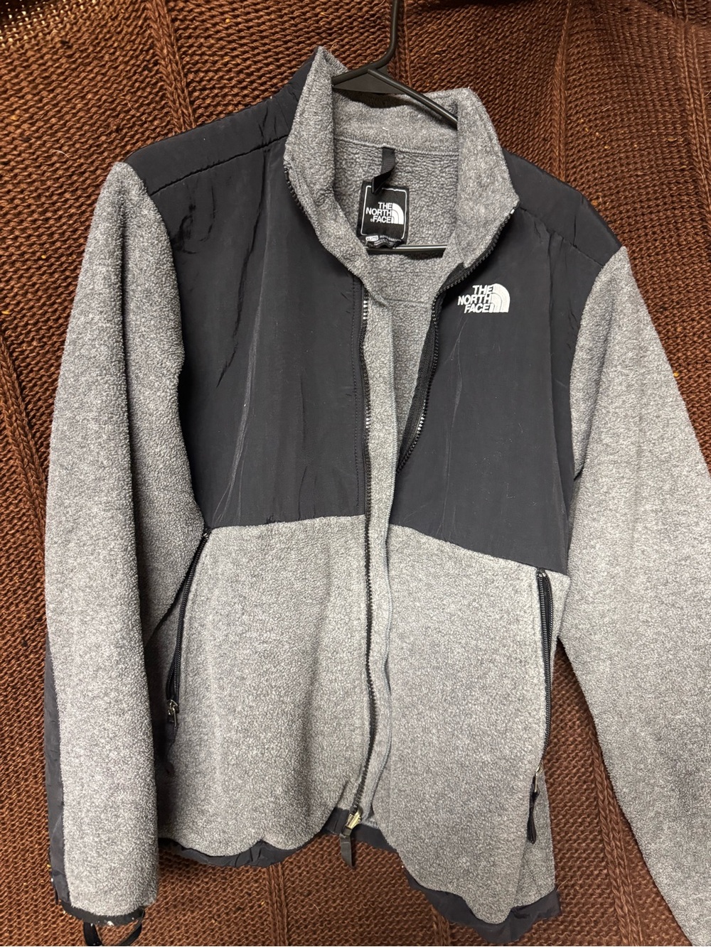 The North Face woman’s Grey and Black Hybrid Fleece Jacket